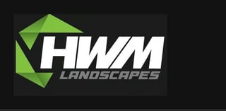HWM Landscapes logo featuring green geometric shapes and white text on dark background